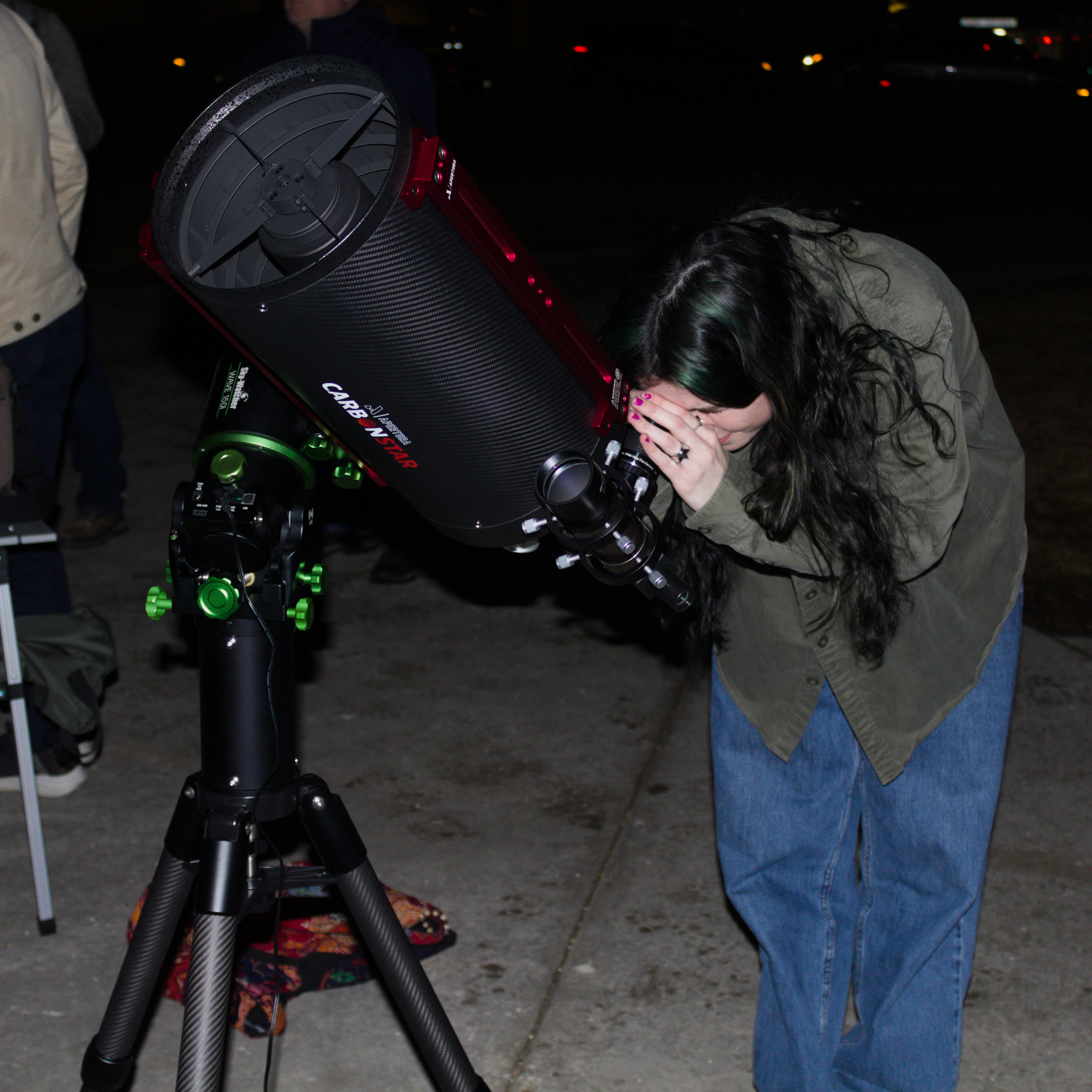 Sidewalk astronomy in Madison - student views the Orion Nebula (crop).jpg